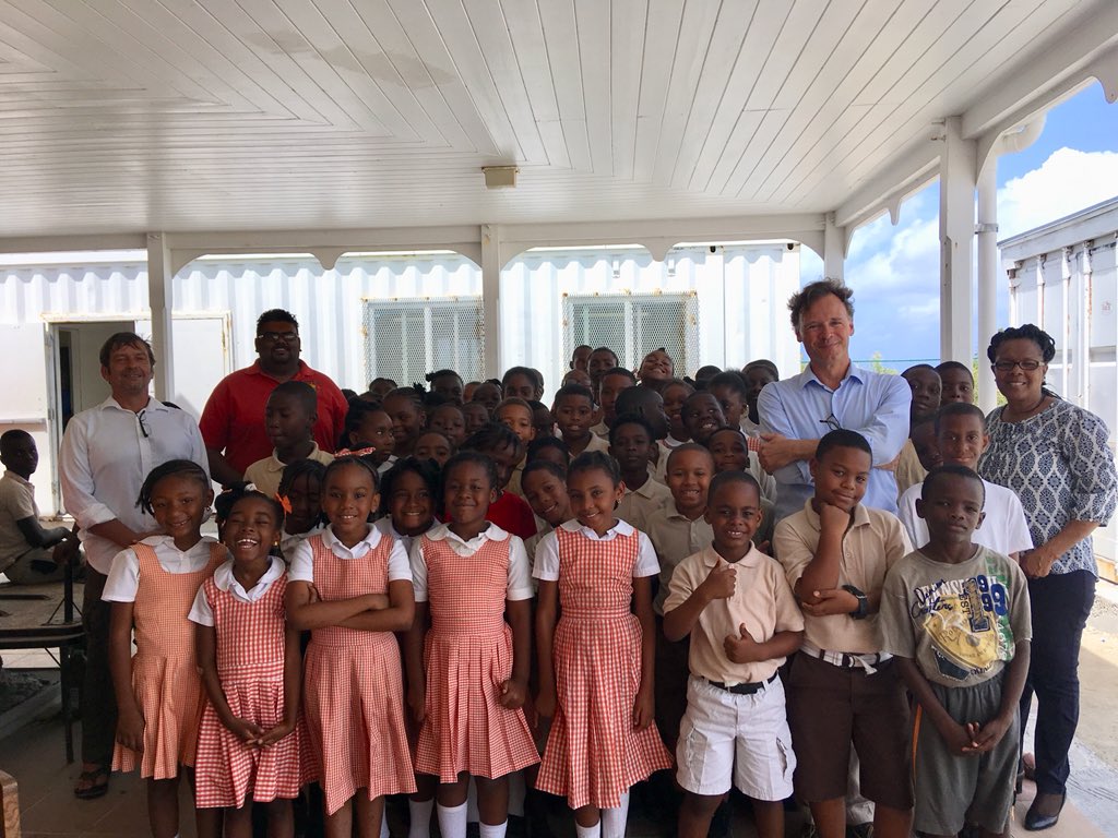1World_Gallery's tweet photo. Another island, another school lecture. Team One World Gallery with students in #grandturk #turksandcaicos https://t.co/K2XT9yQIHc