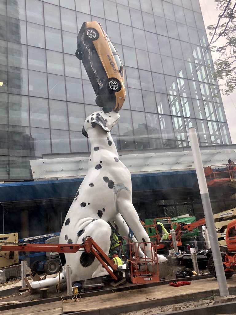 MarkPochapin's tweet photo. What is a child’s smile worth?  Ask “Spot” #SpotTheDog outside of the new children’s hospital @nyulangone.  Spot is the worlds largest #TherapyDog and is balancing a real NYC #Taxi https://t.co/LOVFaMbkZy