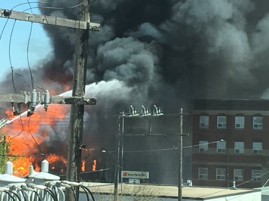 Manitowan's tweet photo. Reports from #cbc in #brandon identify that crews battling the downtown fires seemingly have it under control. Temps 22Cel Wind now 22 km n in Brandon. Hot spots to be tackled. #redcross is helping displaced folks. Business's destroyed. Cause of fire unknown. #bdnmb https://t.co/4H11ss3Gvx