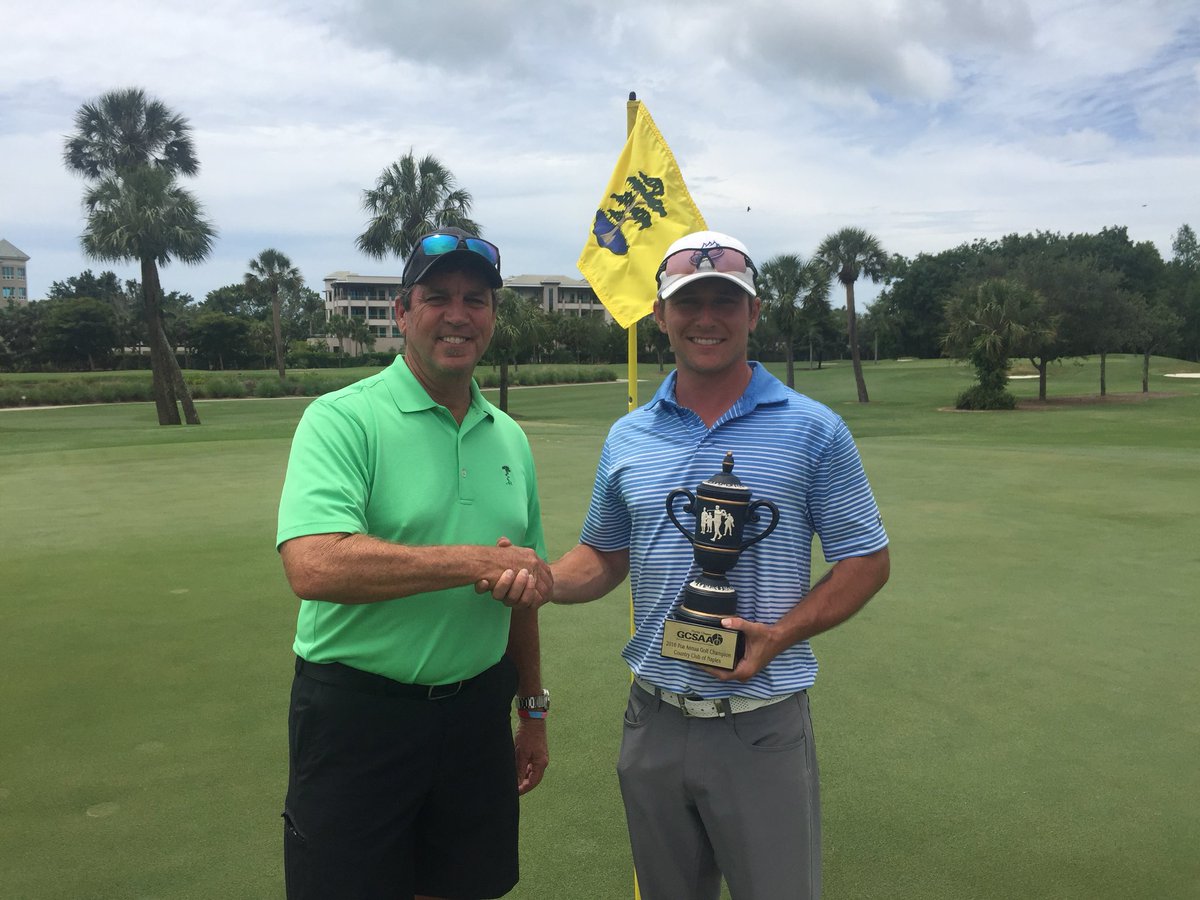 Steve Wright handing the POA Stroke winner trophy to Alex Holt from Gulf Harbour CC with a rd is 72     It took a 3 way playoff