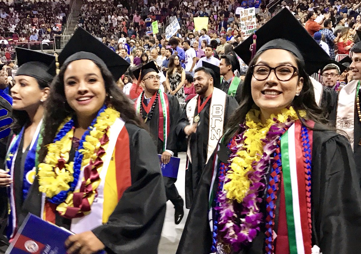 ChicanoGradFS's tweet photo. @JassyFizzle8 styling in una vestidura tradicional custom-made by her abuela just for this #ChicanoGradFS18 milestone. Classmates @_ohhsamsam & @yesiamanda6 taking their last @Fresno_State βcampus walkβ as students tonight! #FresnoStateGrad https://t.co/W3Iehc2rWy
