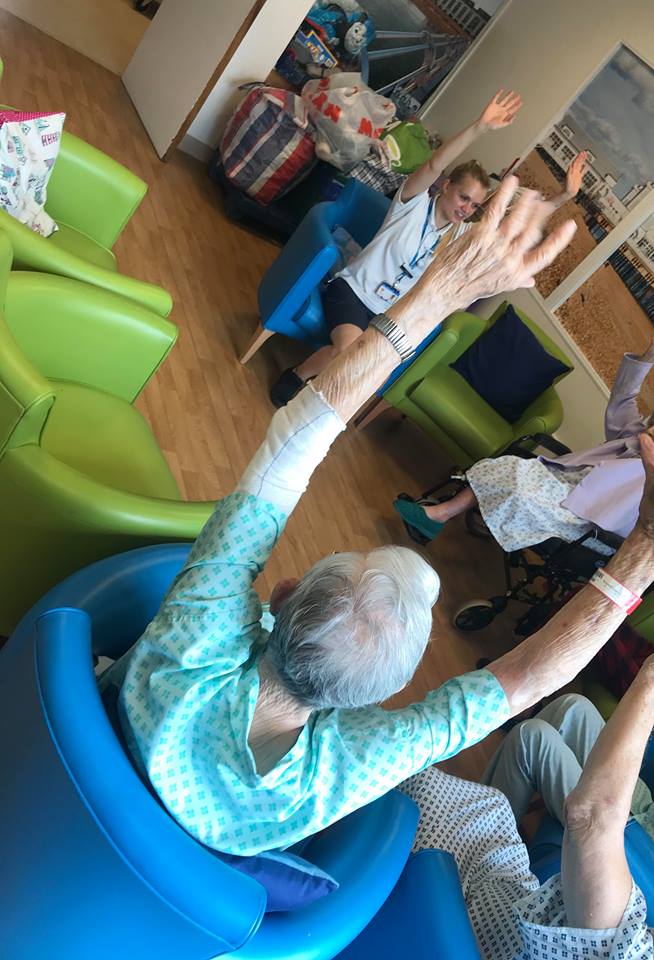 PHU_NHS's tweet photo. Patients were encouraged to ‘Get Moving’ in Memory Lane earlier this week, a great way to get patients up and out of bed.
Led by physiotherapist Eleanor Bryant, patients did a series of warm up exercises moving their arms and legs to music, then enjoyed a game of balloon tennis. https://t.co/f1HmCjxcB9