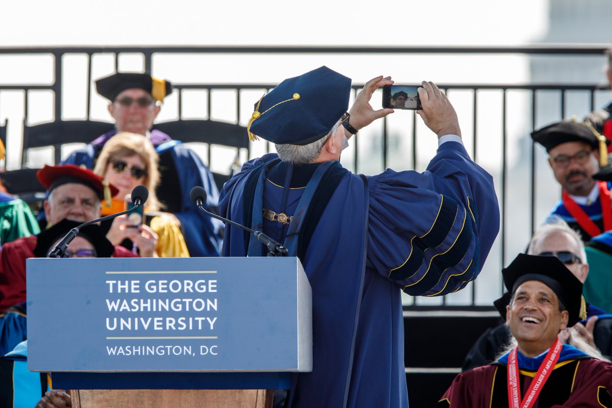 President Leblanc taking a selfie from the commencement podium