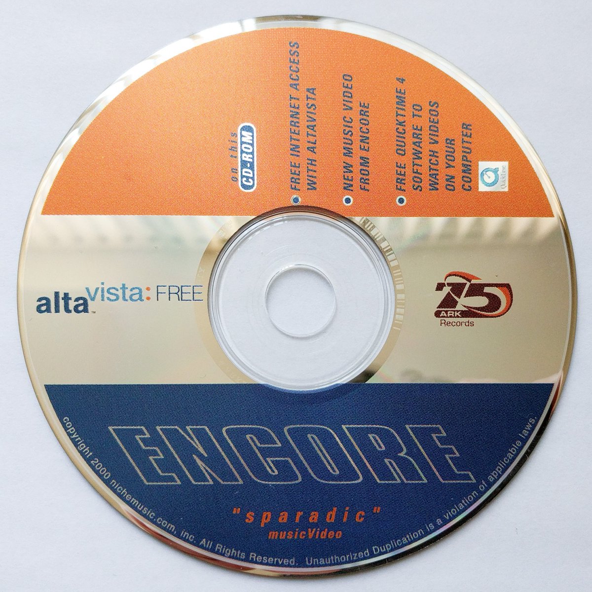 Was ripping old music CDs today and found this in the case for "Tragic Epilogue" by Anti Pop Consortium: from year 2000, CD-ROM with music video for "sparadic" by Encore, including free Altavista internet access and Quicktime 4 software