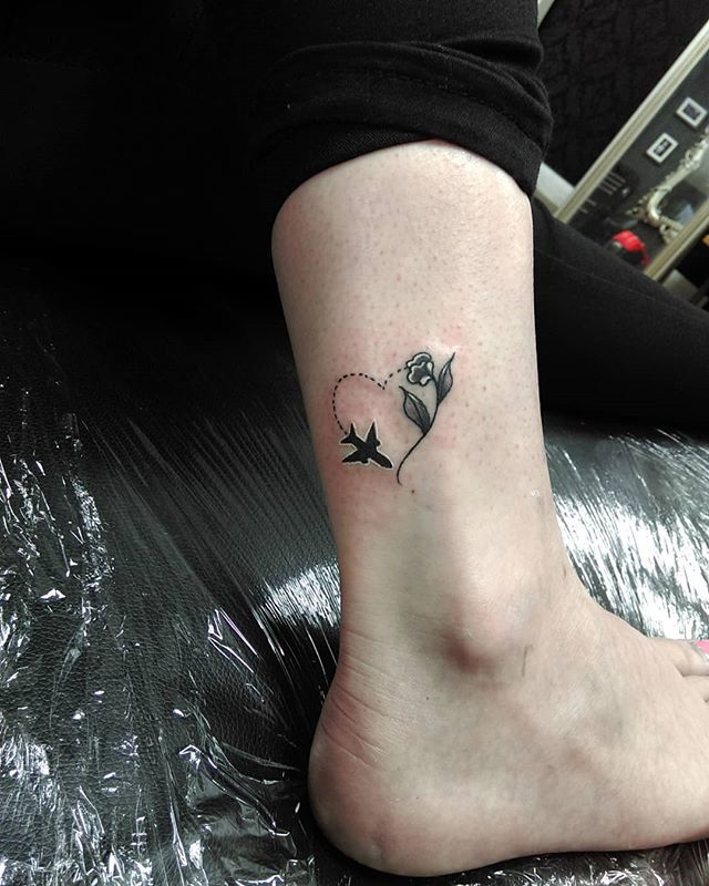 Airplane and paper airplane tattoo on the right inner
