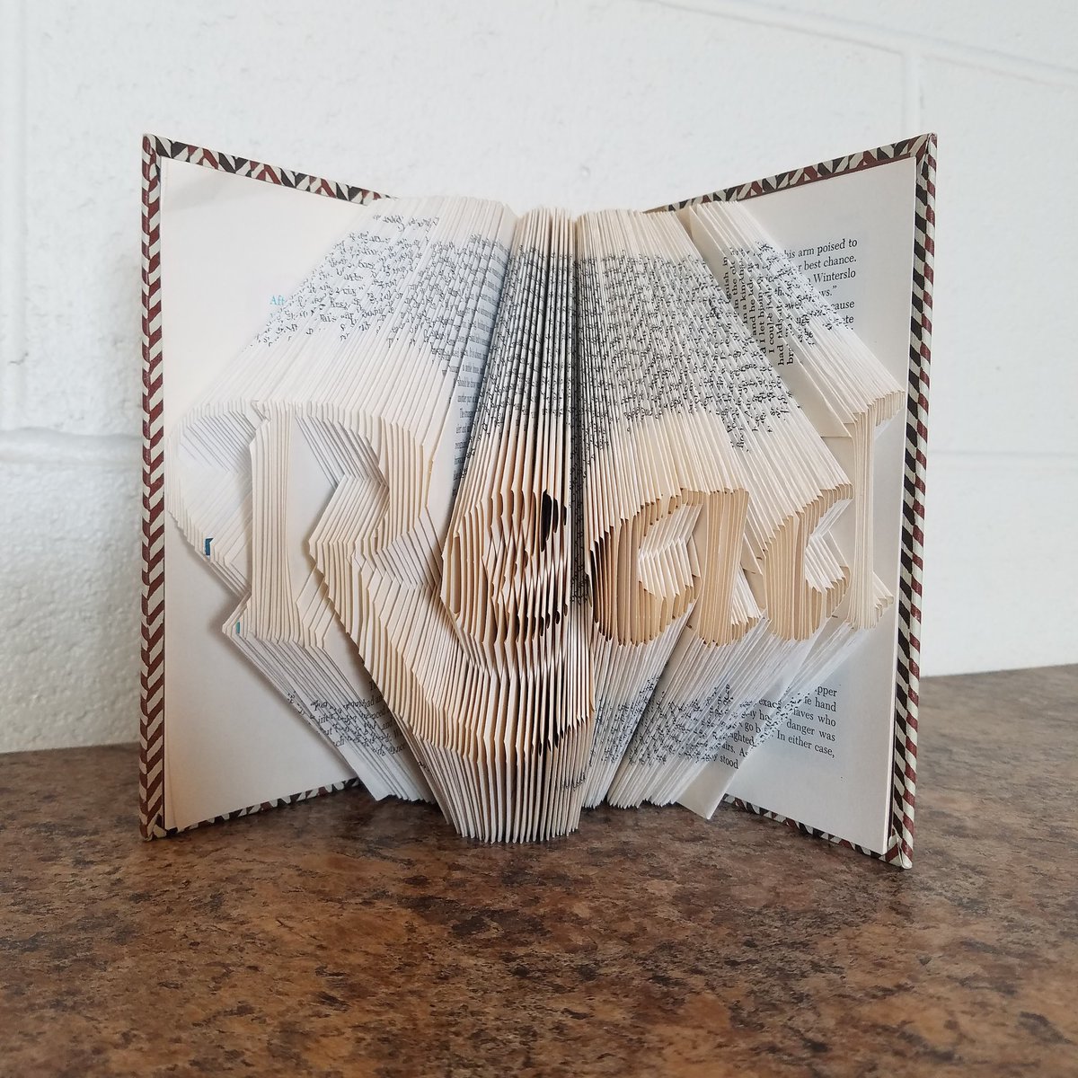 We work with amazing and talented people. We love this use of a discarded book. #upcycle #read #scott2reads #books #etsy #diy
