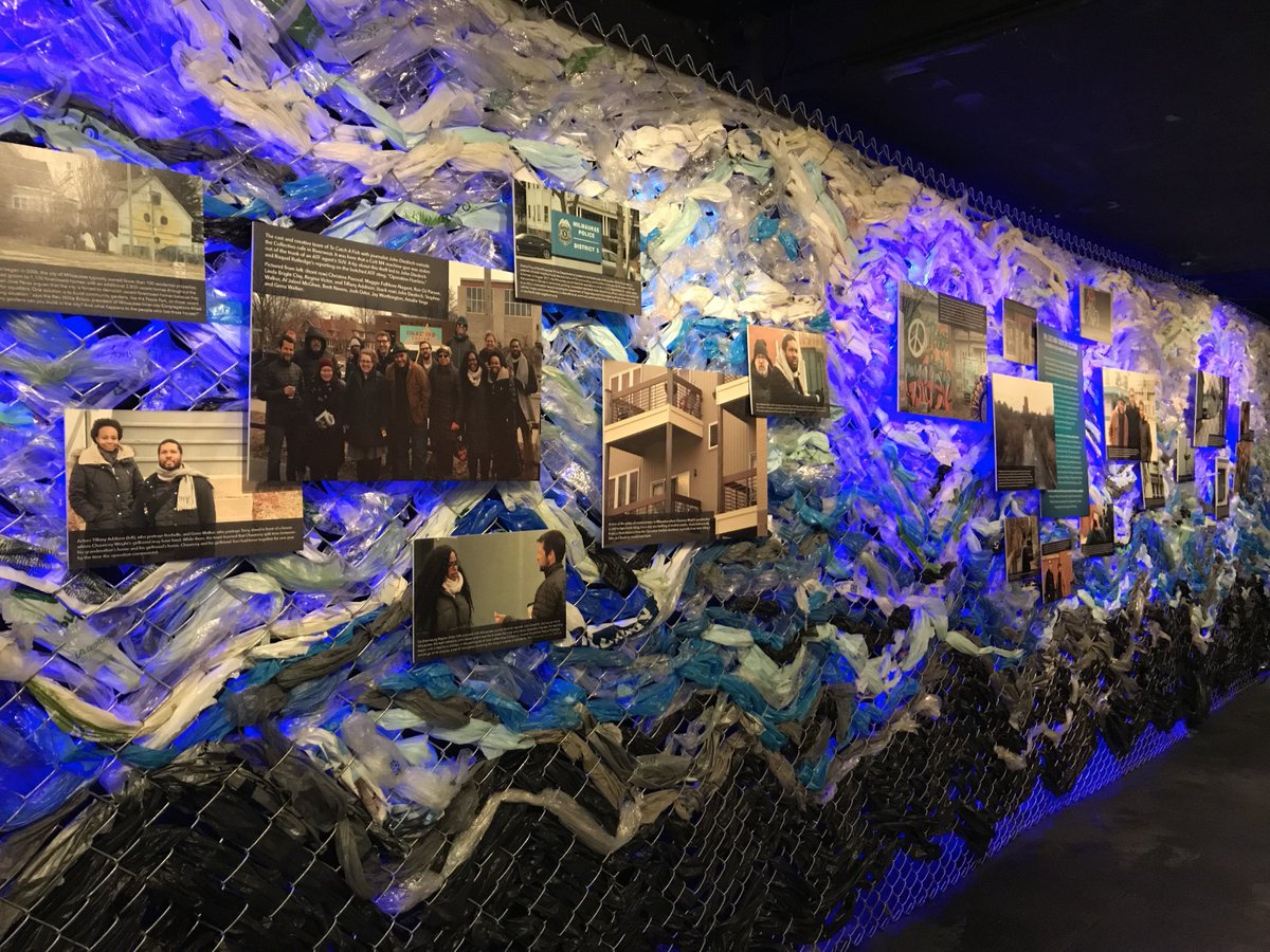 TimeLineTheatre's tweet photo. #ToCatchaFish lobby experience unlike any before! Particularly in love w/this wall of chain link fence, recycled plastic bags, backlit & featuring info about team's visit to Milwaukee exploring locations related to story that inspired play. See it for yourself thru 7/1! https://t.co/GMMFBcmMpi