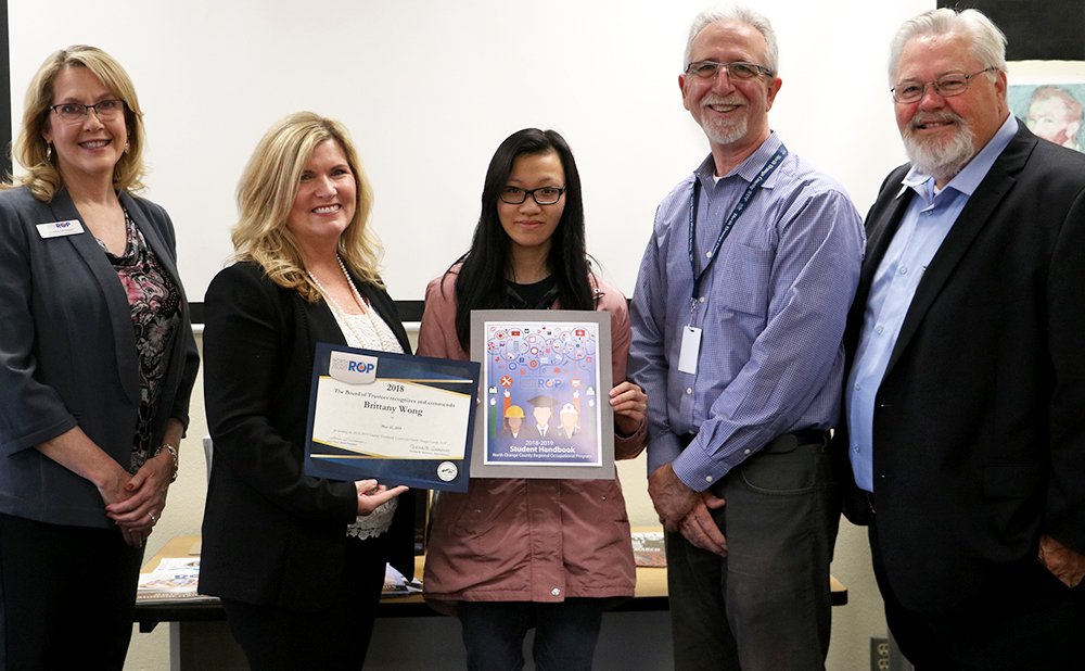 Congratulations to senior Brittany Wong, winner of our Student Handbook Cover Contest! 🏆 She was surprised with the good news and a check for $250 from the Career Education Foundation today during class.