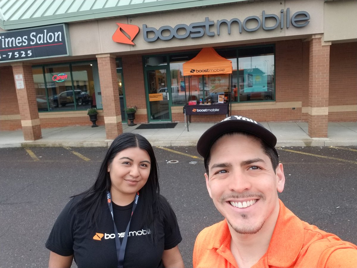 Boost_JoseC's tweet photo. A lil Rain 🌧️ isn't going to Stop Tu Mobile Berlin, NJ from putting that Table and Tent out...we are ready for a STELLAR Sales day here...Also thanks to Jocelyn for taking a selfie in the rain with me...lol @JayMiglionico @SPG_AJ @Phillmychini https://t.co/wfyO2ruhGK