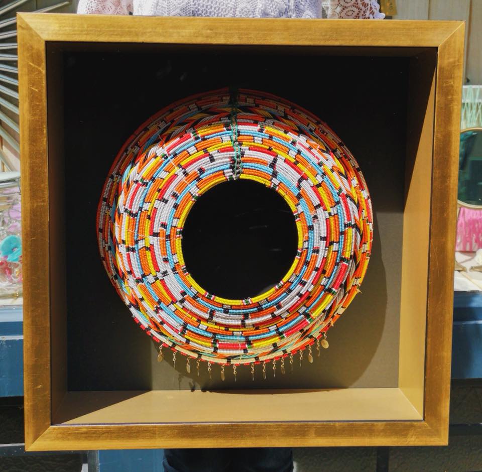 Airlines might limit the size of your souvenirs but we don’t. 
Preserve and display your precious souvenirs. African beads necklace within a a black and gold box, double frame. #memorabilia #souvenirs #beads #Africa