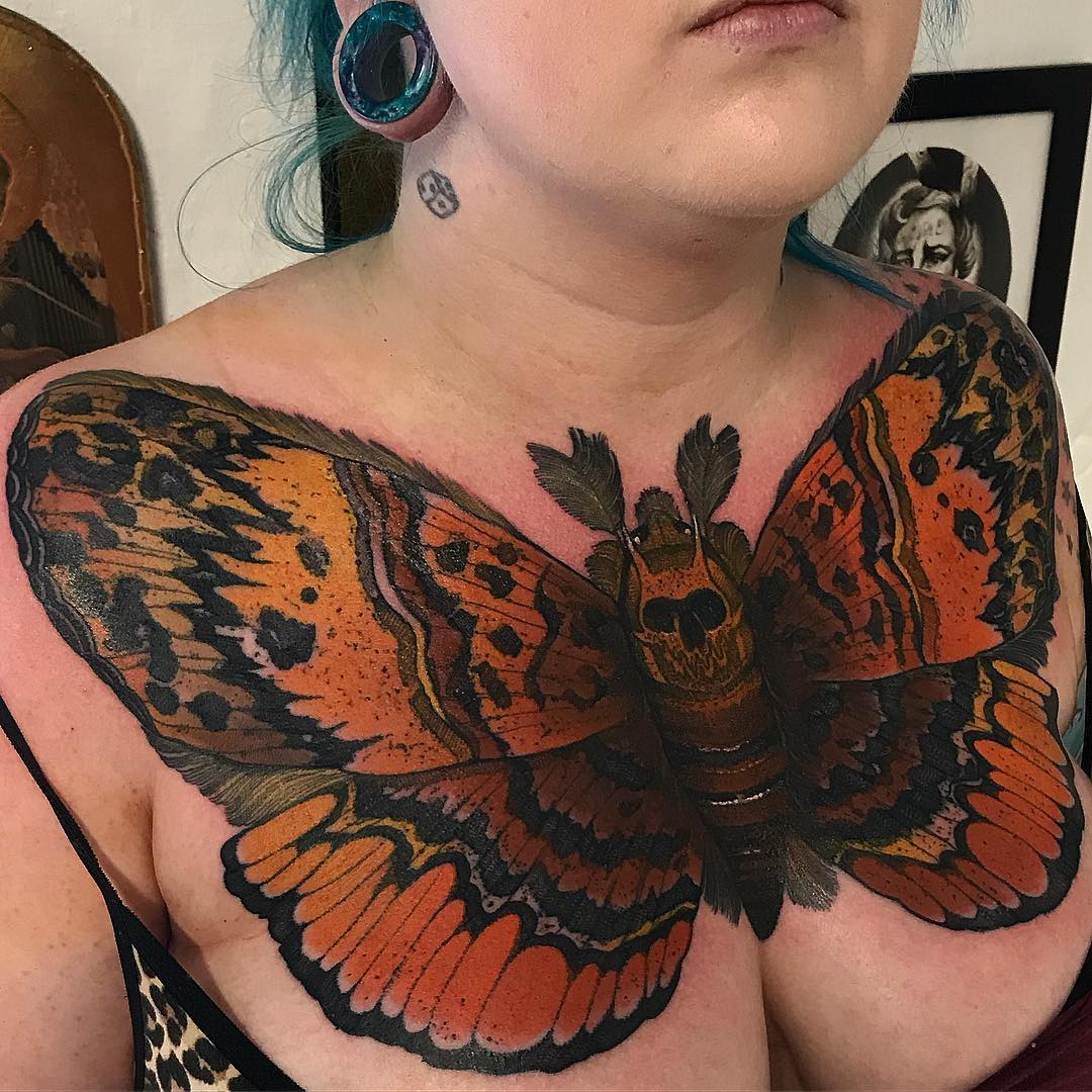 Girl With Chest Moth Tattoo