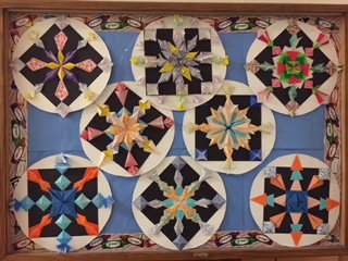 WinthropMPS's tweet photo. Our fourth-grade's origami project: radial symmetry and beauty in one! @MelrosePS https://t.co/9MCrOvqyqM