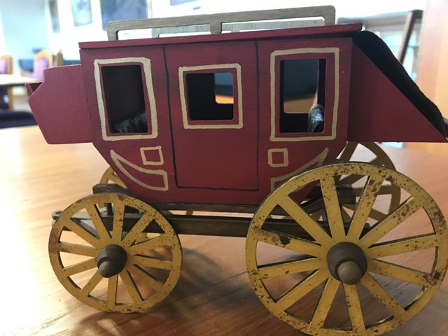 phftucson's tweet photo. It's the beginning of #ExhibitInstallation here at the PHF! Your friendly neighborhood librarian even assembled a model stagecoach for our new display about the unsolved #Wickenburg murders of 1871. More exhibit info coming soon! https://t.co/sDchQiJnx7
