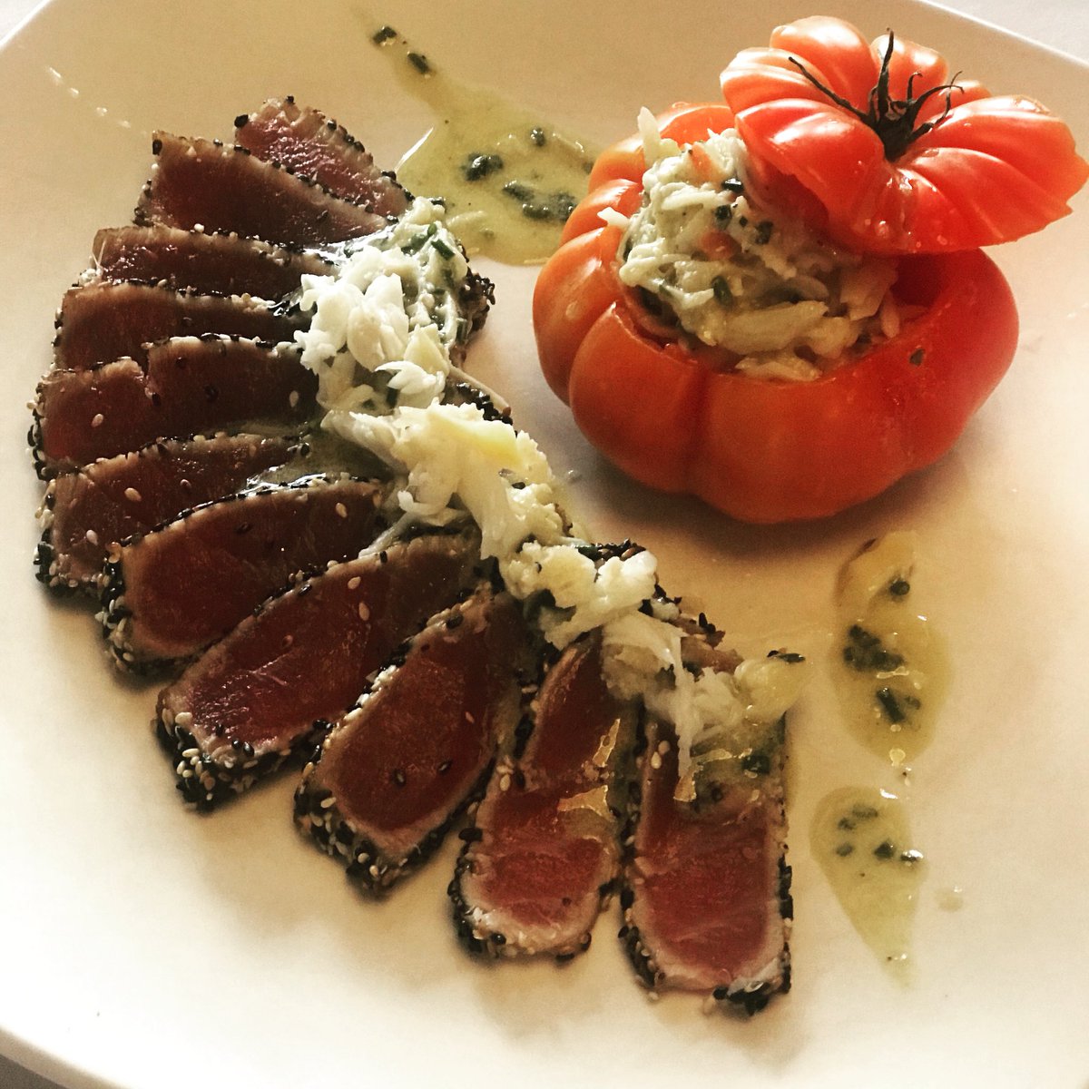 Tonight’s special: seared tuna with Alaskan king crab leg in roasted heirloom tomato and chive vinaigrette
