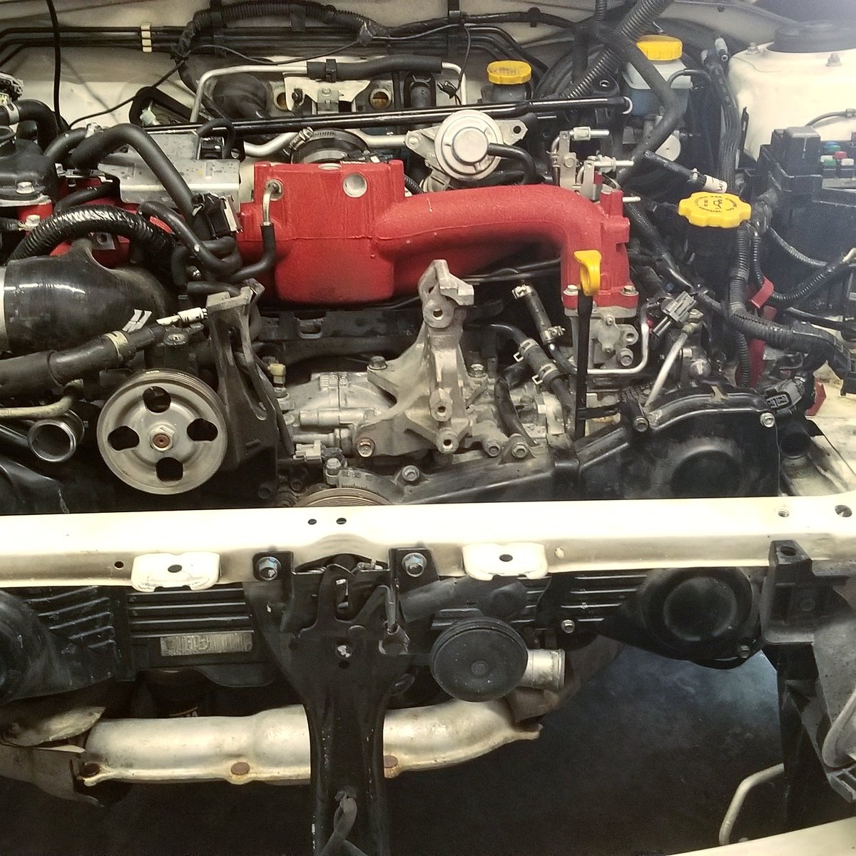 HeelToed's tweet photo. She's ready for major surgery!  Make sure to check out the link in my bio for the latest video.  Getting ready to pull the motor and swap on some forged internals #heeltoed #subaruwrxsti #sti #wrxsti #ringlandfailure #EJ257 #manleypistons https://t.co/y9cE2wtkqB