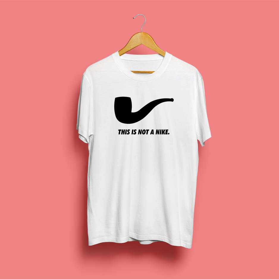 weprintsocial's tweet photo. The Treason of Brands by artist #MathieuTremblin is a hijacked #t-shirt echoing #RenéMagritte's painting #TheBetrayalofImages questioning representation, in the field of #branding and pointing to the relationships that unite #diversion, #copy, and #counterfeiting. #printsocial https://t.co/cncvSn7EWc