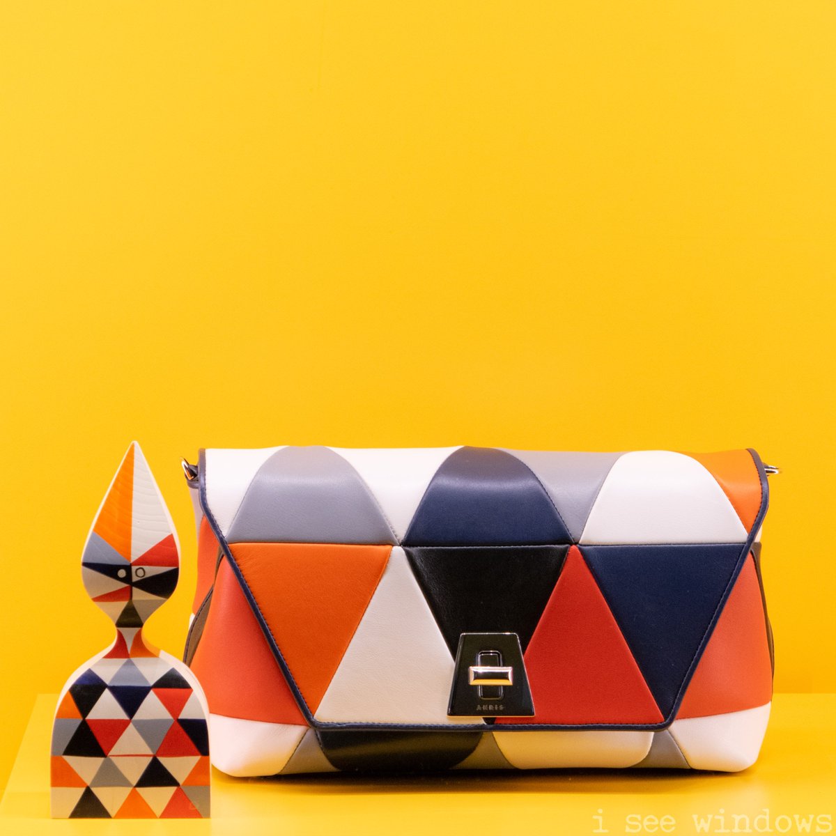 iseewindows's tweet photo. hello you! this #alexandergirard @vitra doll serves as a testimonial for the inspiration behind this @akris_official #ss18 clutch #viadellaspiga #milan. #iseewindows #windowscience #visualmerchandising #shopwindow #vetrina #escaparate https://t.co/Zk2OpaWUdW