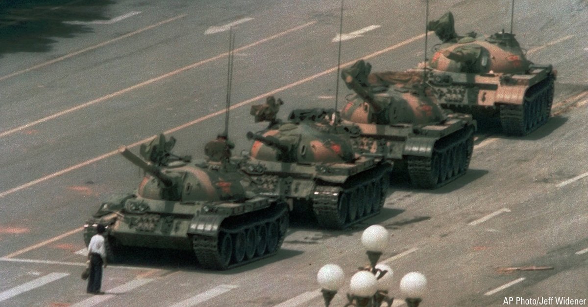 On this day in 1989, a Chinese man stands alone to block a line of tanks in Tiananmen Square. The man, calling for an end to the recent violence and bloodshed against pro-democracy demonstrators, was pulled away by bystanders and the tanks continued on their way.