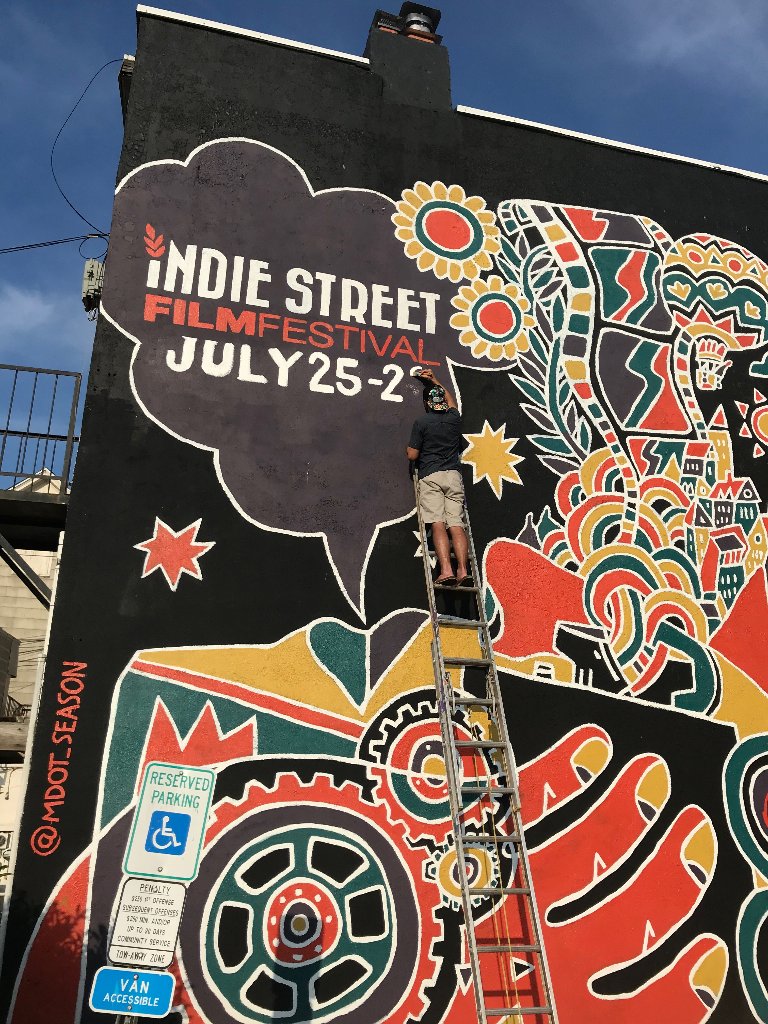 IndieStFilmFest's tweet photo. You're on notice! #indiestreet2018 officially returns to #RedBank July 25th-29th! New films, new partnerships, & new experiences...don't miss your chance to be a part of this amazing art & film 5-day event. #mocoarts #monmoutharts #filmfestival #indie #mural art by @mdot_season https://t.co/8UyBYlhAWy