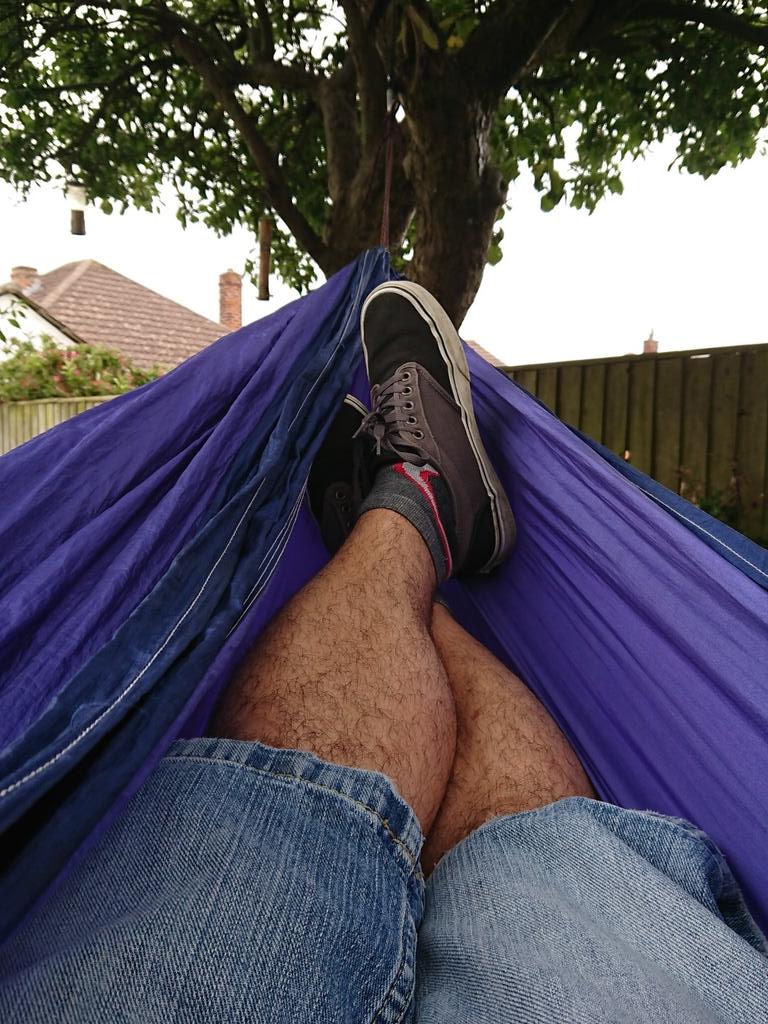 A day off from #paddleboarding today, so I'm chilling in my @hammockbliss under the apple tree! Pretending to work, but really just #relaxing #suplife #getmoreadventure #sup #standuppaddling #hammockbliss