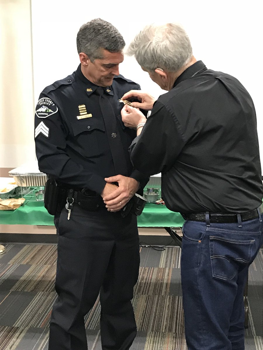 PierceSheriff's tweet photo. It is very special honor for a father to pin a badge on a deputy. It is also a very special honor for a son to have his father unpin his badge 28 yrs later when he retires. At Sgt. Cassio's retirement party we witnessed this touching moment between a proud father &amp; a humble son. https://t.co/c80BpIWlSf