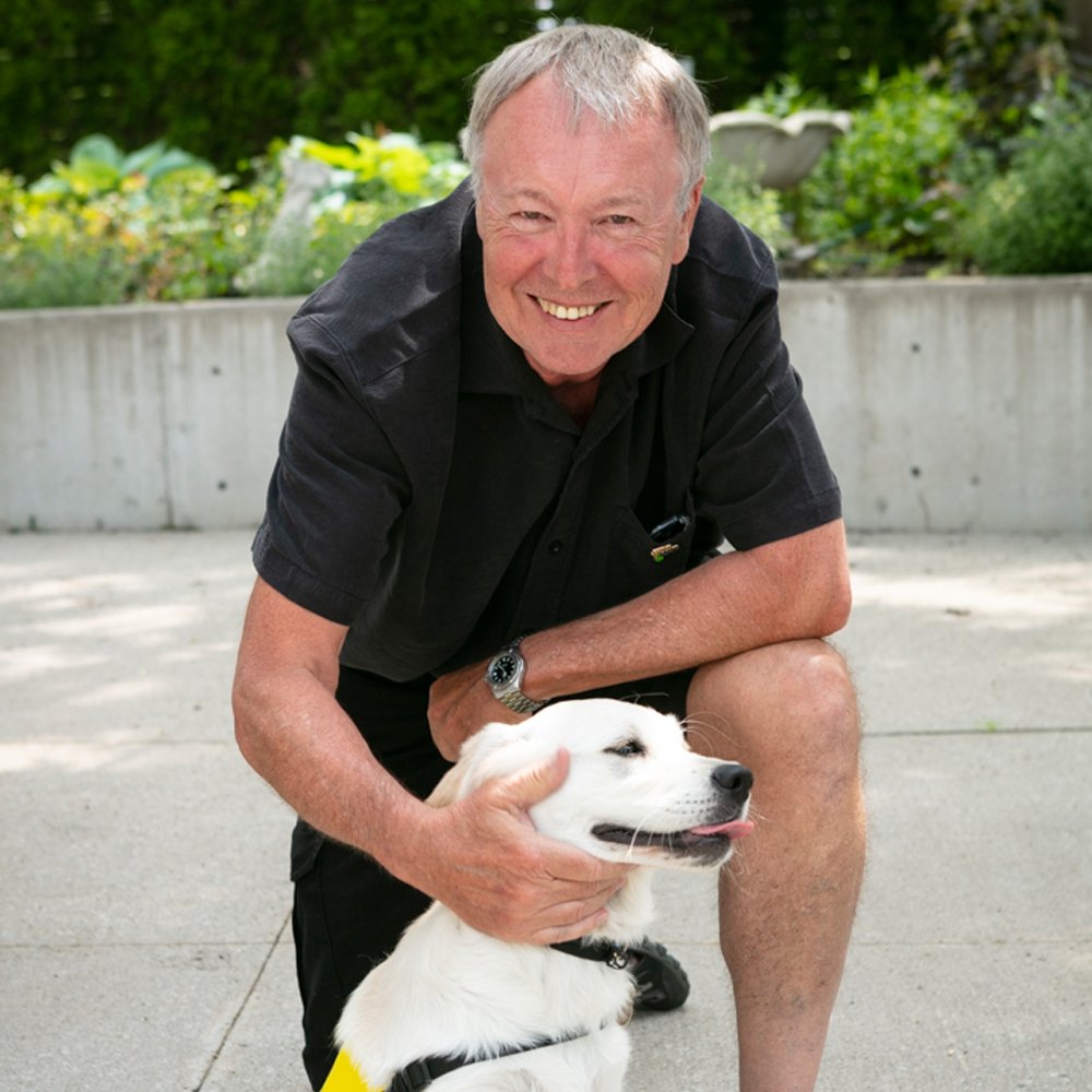 CNIB's tweet photo. Meet two of our newest future #CNIBGuideDogs - Elsie &amp; Ruggles! A big thank you to their generous sponsors Graham Williams (in black, pictured with Elsie) and John Rook (in purple, pictured with Ruggles). https://t.co/nQgiTNnJGZ