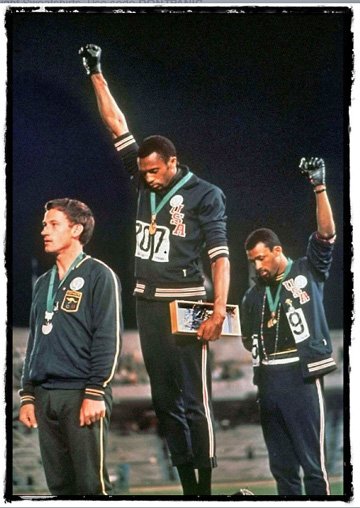 1968 Olympics with the upheld fists for human rights.