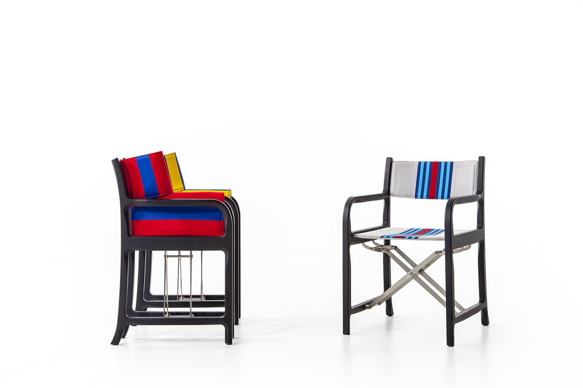Cassina's tweet photo. Cassina Contract has customised the 298 director's chair by Michele De Lucchi with a creative idea by Lapo Elkann and the Style Centre of Garage Italia Customs. The chair features a black frame and graphics inspired by sports car liveries. https://t.co/ECkC01oacl