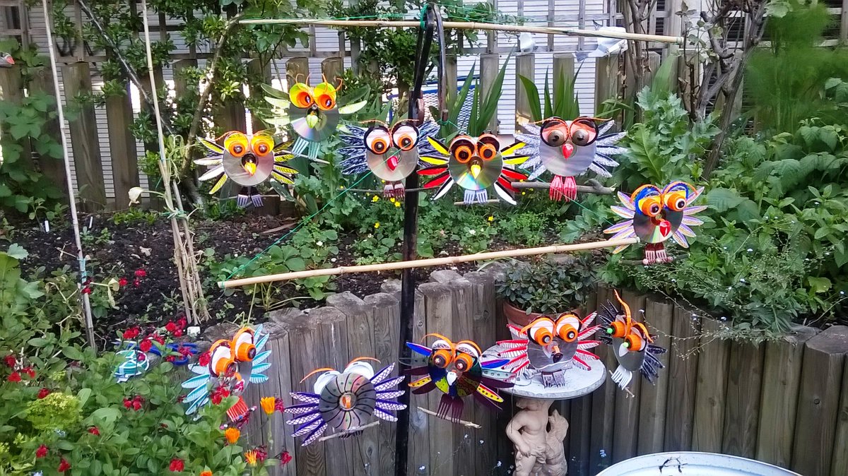 AbbeyCCnw6's tweet photo. Look at what our Re-cycle-art group have been up to! These gorgeous little owls were made from recycled CDs, plastic forks and bottle tops and look beautiful handing in the Abbey garden 💚👩🏽‍🎨🦉 https://t.co/HIfCmySMYa