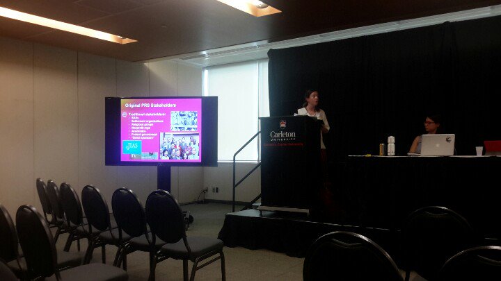 ESPMINetwork's tweet photo. Samantha Jackson discussing the Ryerson Lifeline Syria Challenge.  Syrian crisis required new forms of engagement in relation to new civic society actors supporting resettlement in Canada #CARFMS2018 #ESPMIResearchClusters @_carfms @RefugeeReview @ClaireM_Ellis @anniezeanbean https://t.co/t4KrsPYa42