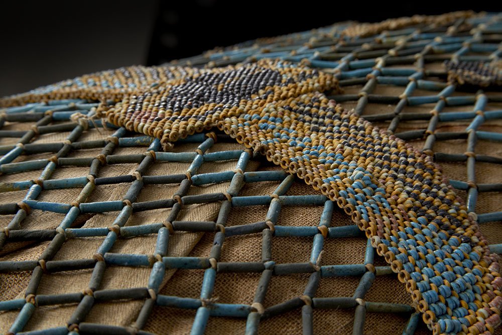 AshmoleanMuseum's tweet photo. A network of faience beads covering the innermost coffin of the mummy of Djed-djehuty-iuef-ankh, our #ObjectoftheMonth for May. 'Djed' was found in 1895 buried within the grounds of the temple at Deir el-Bahri, Thebes and dates back to 770–712 BC https://t.co/aGLUeR4b1j https://t.co/SEcDQpPD5U
