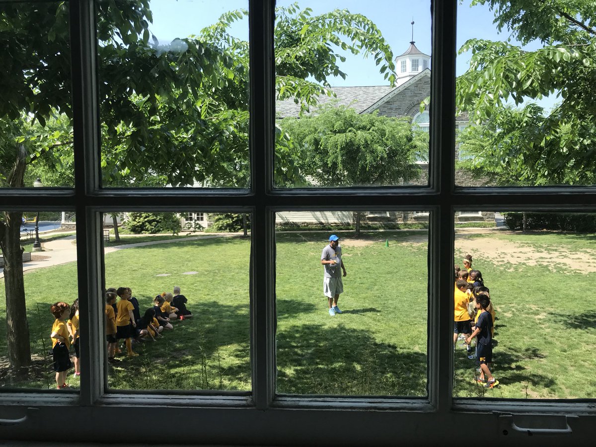PennCharter's tweet photo. View out the window from a #PCseniorcomp presentation: first grade practicing for #125thColorDay! The games begin at 1pm https://t.co/2yhXlLG0s8
