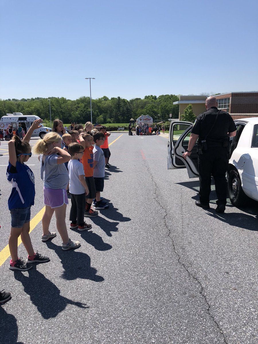 MrsElliott2nd's tweet photo. We had a great time at Vehicle Day... except for James. He ended up in the back of the police cruiser.  😂#easthighleaders https://t.co/tvg0Fdiatf