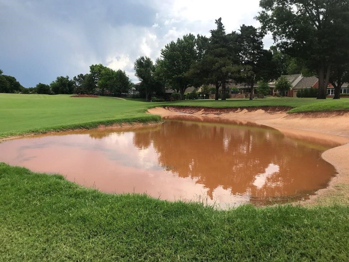 bergingolf's tweet photo. Just got these pics form our GM at @QuailCreekOK . 2.5” of rain on an old and new bunker.  Our design and @CapConGolf doing their job! @QC_Maintenance @QC_Golf_Shop https://t.co/bAywSNtVyG
