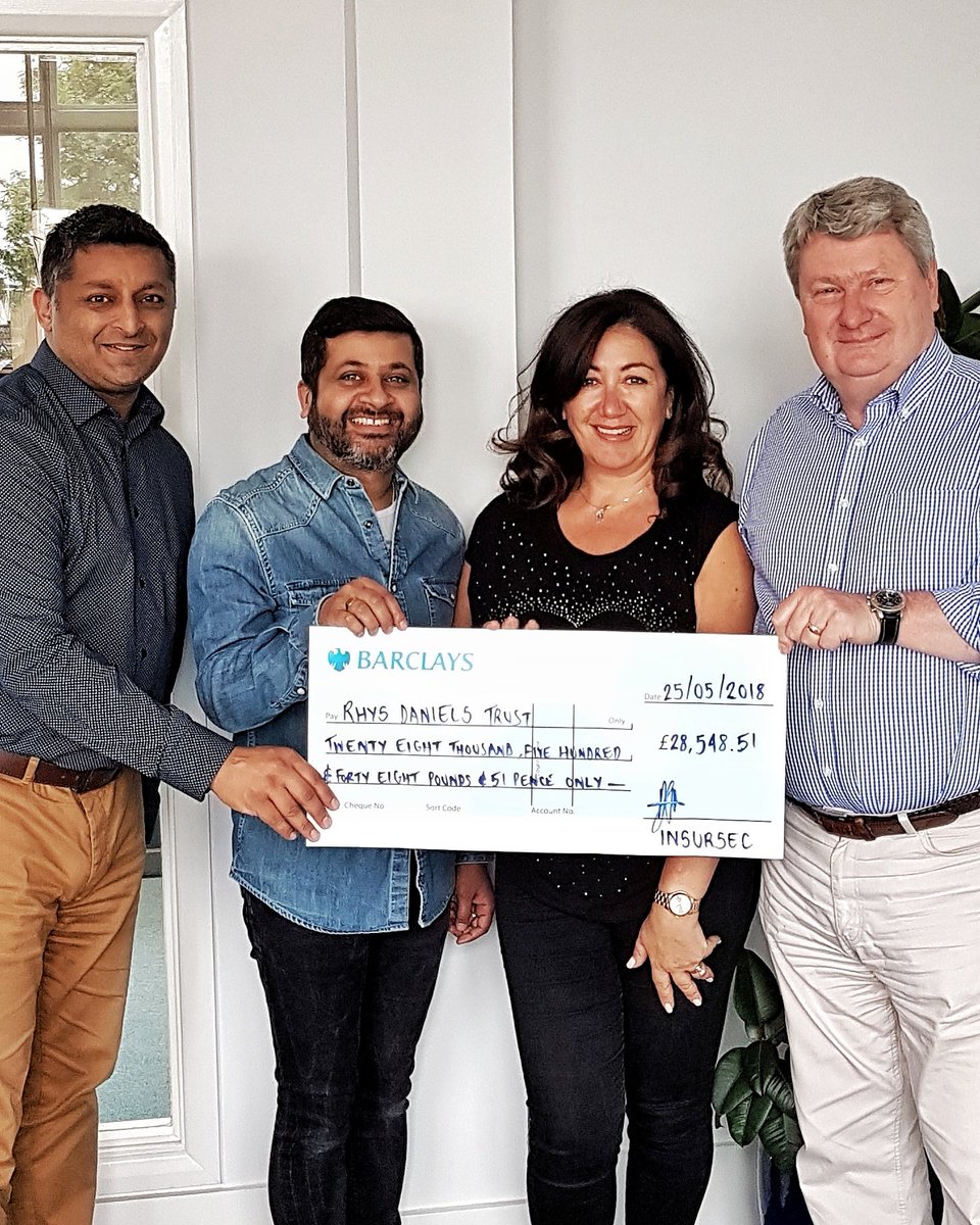 Thomas Powell, Prakash Sudra and Bijal Pattani of Insursec Risk Management/Insursec Prestige presenting Nicky Weinrabe of the Rhys Daniels Trust with a cheque in the sum of £28,548.51. This was raised at the Rhys Daniels Trust Supercar Sunday event at North Weald Airfield.