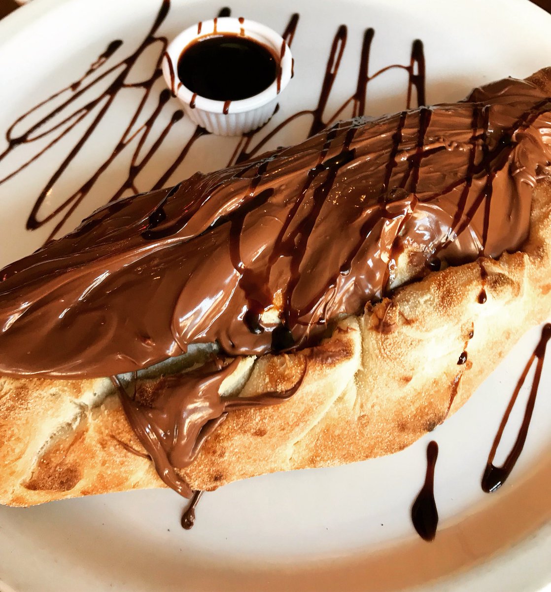 Not your ordinary Calzone. 
Calzone filled with banana🍌,marshmallow 🍥&amp; the goodness of NUTELLA🍫
Pizza however you like it ✔️
#beattheheat 
#pizzayourway #pizzaisalwaysagoodidea 
#pizzasnddessert