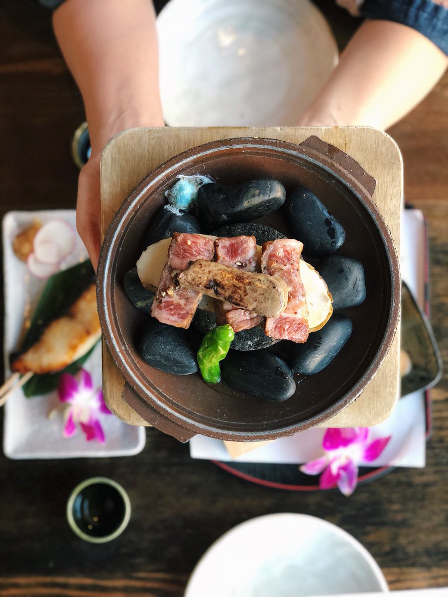 Wagyu with Foie Gras served on hot lava stone grill. Need we say more?