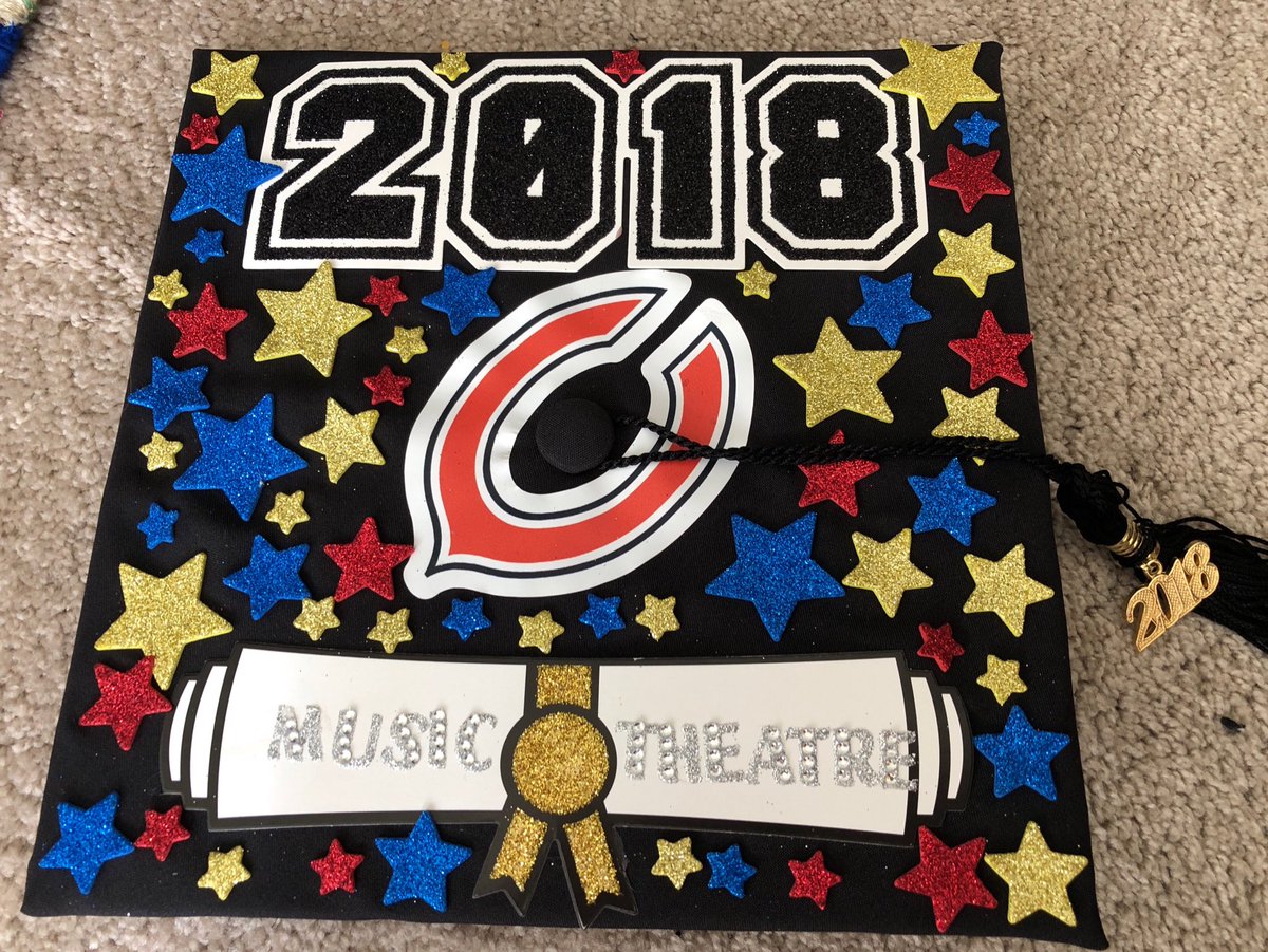 Decorating his grad cap