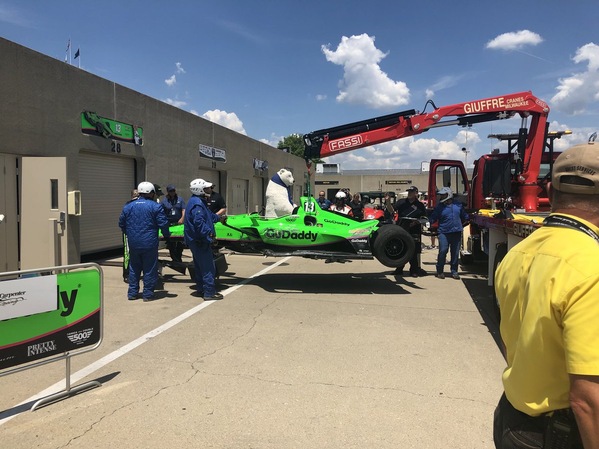 CliftonGBrown's tweet image. Danica’s damaged car being returned to garage.  I’m with media outside medical, waiting for her to emerge and comment on wreck that ended her race.