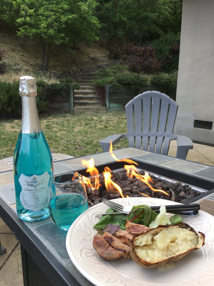 A backyard barbecue with blue sparkling wine! #Blancdebleu #sparklingwine #backyardbarbecue #porkloin #veges #bakedpotato  #bluesparklingwine #brut #firepit #memorialdayweekend  #relax #celebrate