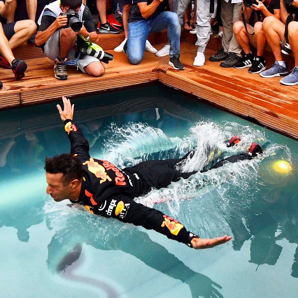 MARK SUTTON on Twitter: "My perfect photo of Ricciardo celebrating the perfect 10 10 swallow dive into the Red Bull Racing pool #f1 #redbullracing #danielricciardo #monacoGP #monaco #montecarlo #victorydive