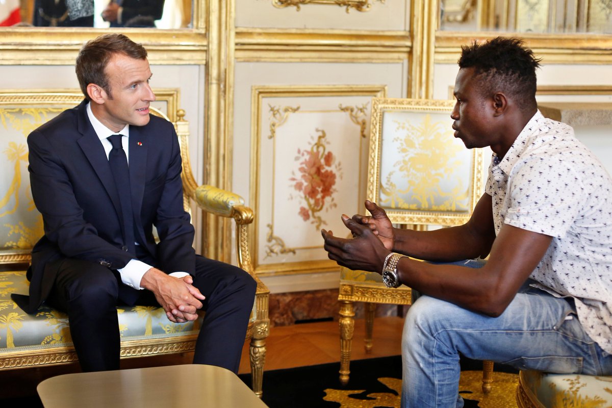 euronews's tweet photo. Mamoudou Gassama, 22, from Mali, is pictured during a meeting with French President Emmanuel Macron at the Elysee Palace in Paris, France.

https://t.co/BChX2moHlQ https://t.co/07pml1Gy5V
