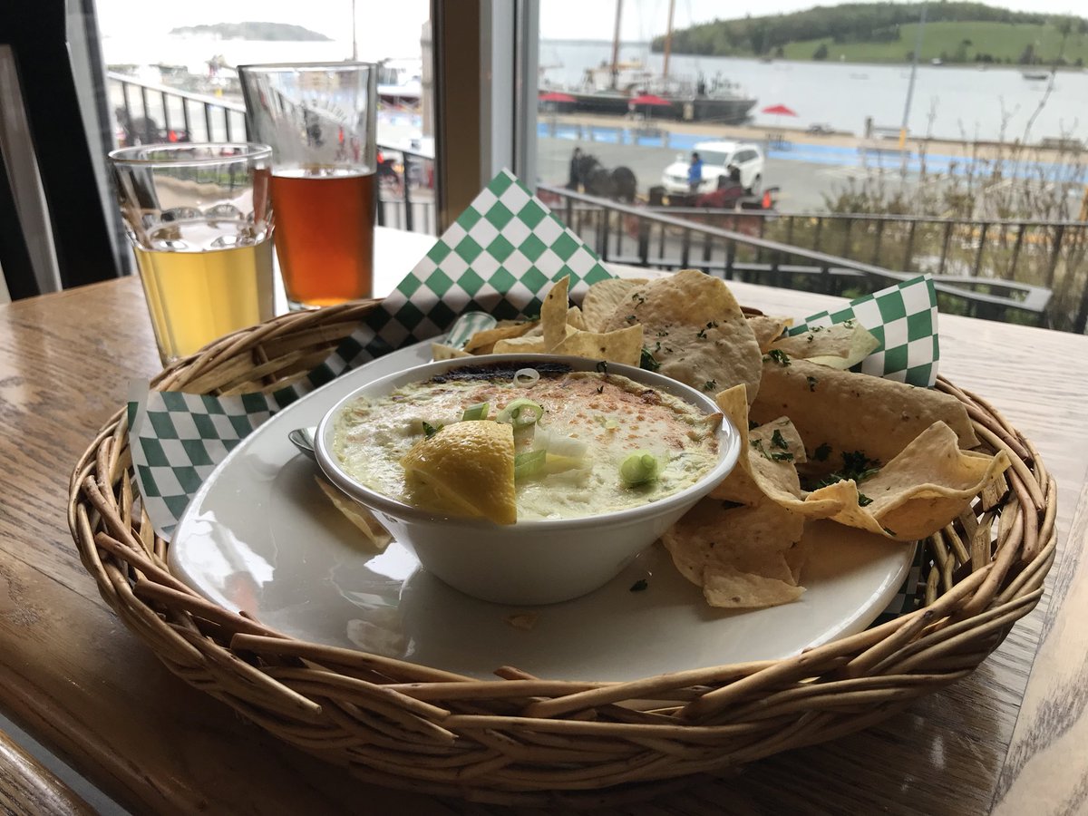 Heathercowper's tweet photo. Dinner at the @BrigantineInnNS in #Lunenberg - the Cajun style fish stew was backed with scallops and giant prawns and I had a starter of crab, spinach and cream cheese dip - served up with a view of the harbour and a taste of local craft beers @VisitNovaScotia #explorecanada https://t.co/9V3bPA6Rqz