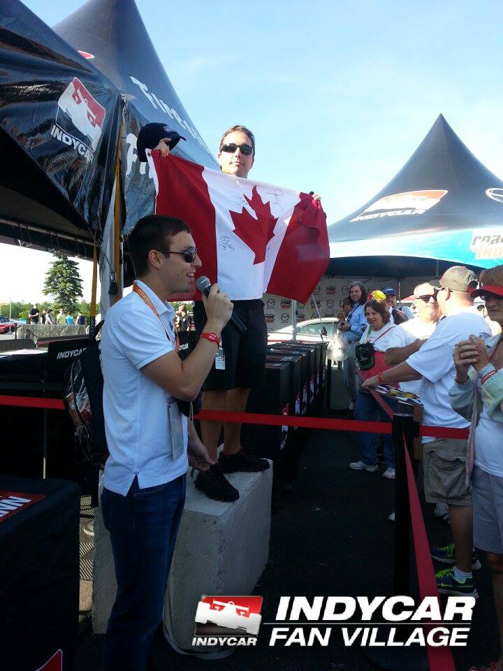 NAUSECAR's tweet photo. @hondaindy @Hinchtown @TOMotorsports Singing anthem @poconoraceway @IndyCar Fan village in 2013 - that is my Canada flag signed by #RonFellows, @Hinchtown, #JacquesVilleneuve, #AlexTagliani, @paultracy3 , and soon to be this year - @robertwickens https://t.co/wEPpCIWwwS