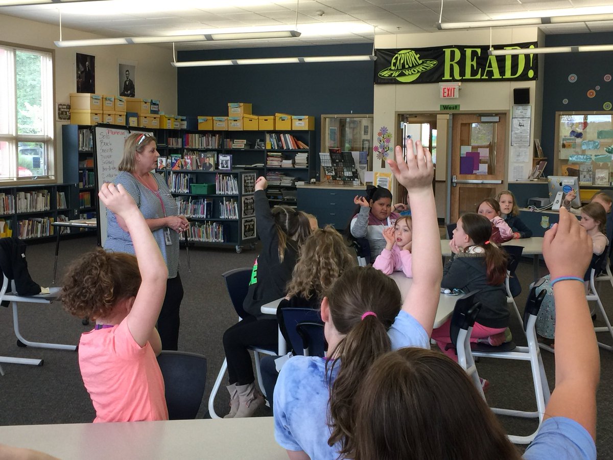 Ms. Woodbrook with our 4th grade students in our library. Students were exploring the difference between Veterans Day and Memorial Day. Many of us may not know :) <a href="/EOESEagles/">East Orient Elementary School</a> <a href="/greshamschools/">Gresham-Barlow SD</a>