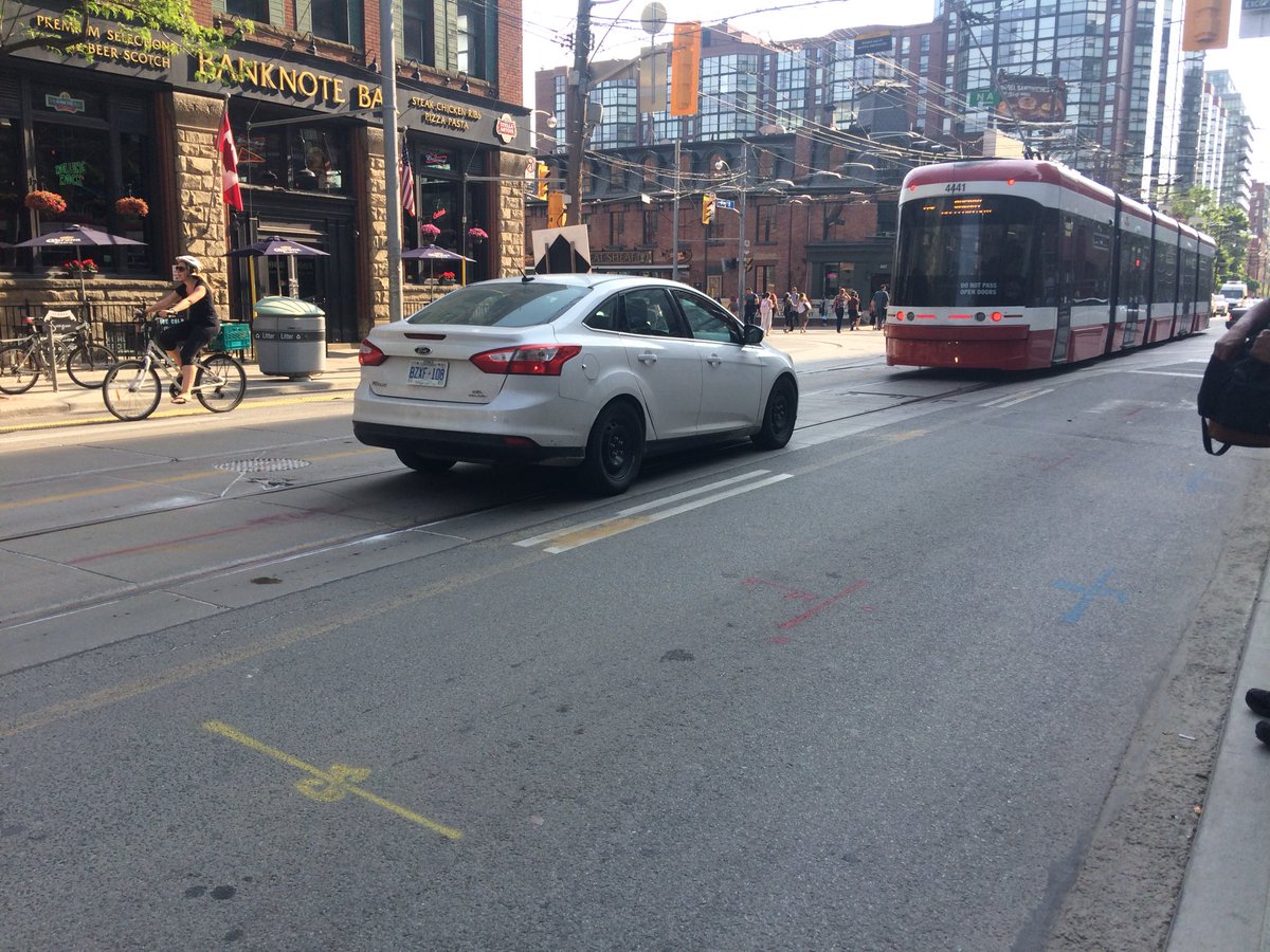 TOCitizenCop's tweet photo. Same ol song and dance.   Cabs have joined the regular fray of people who just don’t care.  #KingStreetPilot #caught #toronto https://t.co/dduPoveps2