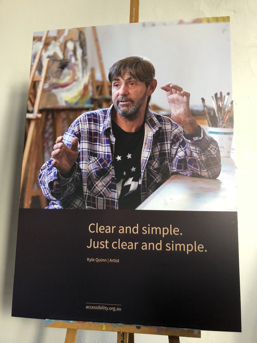 An exhibition of an man with checked shirt. The caption reads “Clear and simple. Just clear and simple’
