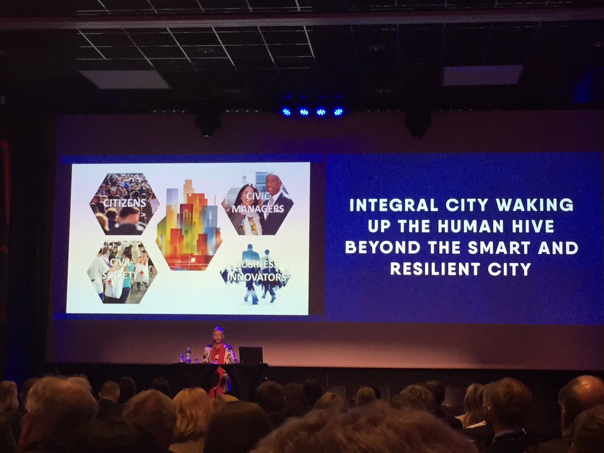 markojurmu's tweet photo. Marilyn Hamilton keynote at #6Aika event in #Oulu: Cities have functional roles similar to bees in a #beehive, resulting in a #humanhive. https://t.co/MZi9CpUTcH