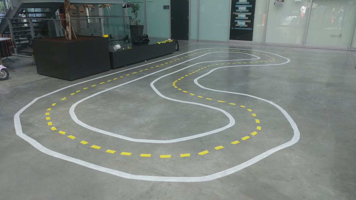 FoxInATX's tweet photo. The Gr8Prix race track has been constructed.  Robot cars forthcoming.  @gr8conf #MachineLearning #robotcars #micronaut https://t.co/FcfpSfjcMk