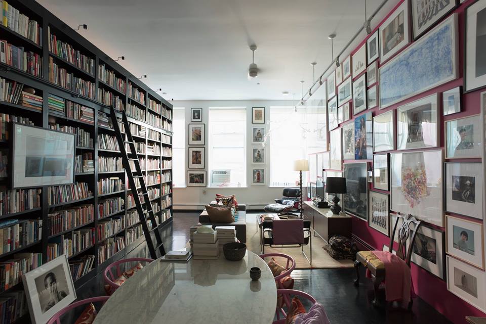 Novelist Hanya Yanagihara's one-bedroom New York apartment where she lives with 12,000 books and her art collection. She always arranges the books alphabetically. The flat has no dividing walls; instead, the vast, double-sided bookcase acts “as a kind of suggestion of a wall”.